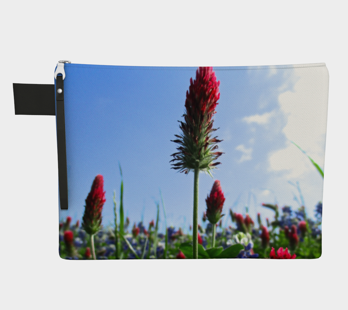 Zippered carryall bag with red Indian paintbrush flowers and bluebonnets in a green field