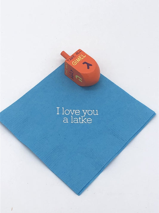 Light blue cocktail napkin with silver I love you a latke slogan