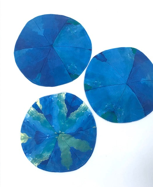 three blueish greenish kippot