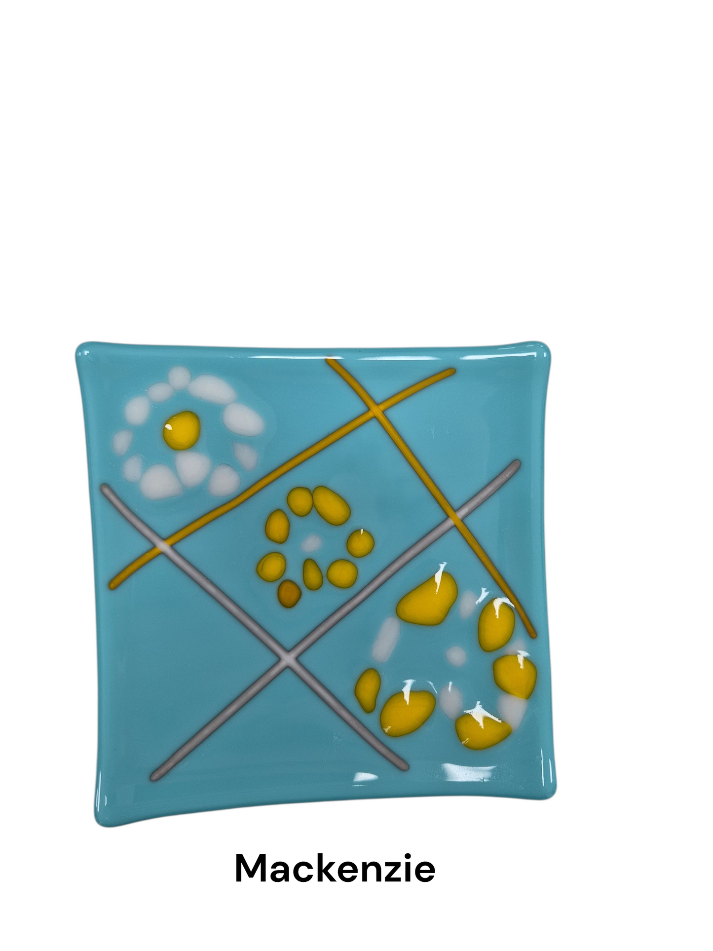 Handcrafted fused glass art tray, it features a playful, geometric design reminiscent of a game of tic-tac-toe, with intersecting diagonal lines and abstract floral clusters in bright yellow and white set against a soft, sky-blue background.

Medium: Fused Glass

Size: Approximately 6" x 6"

Year: 2026