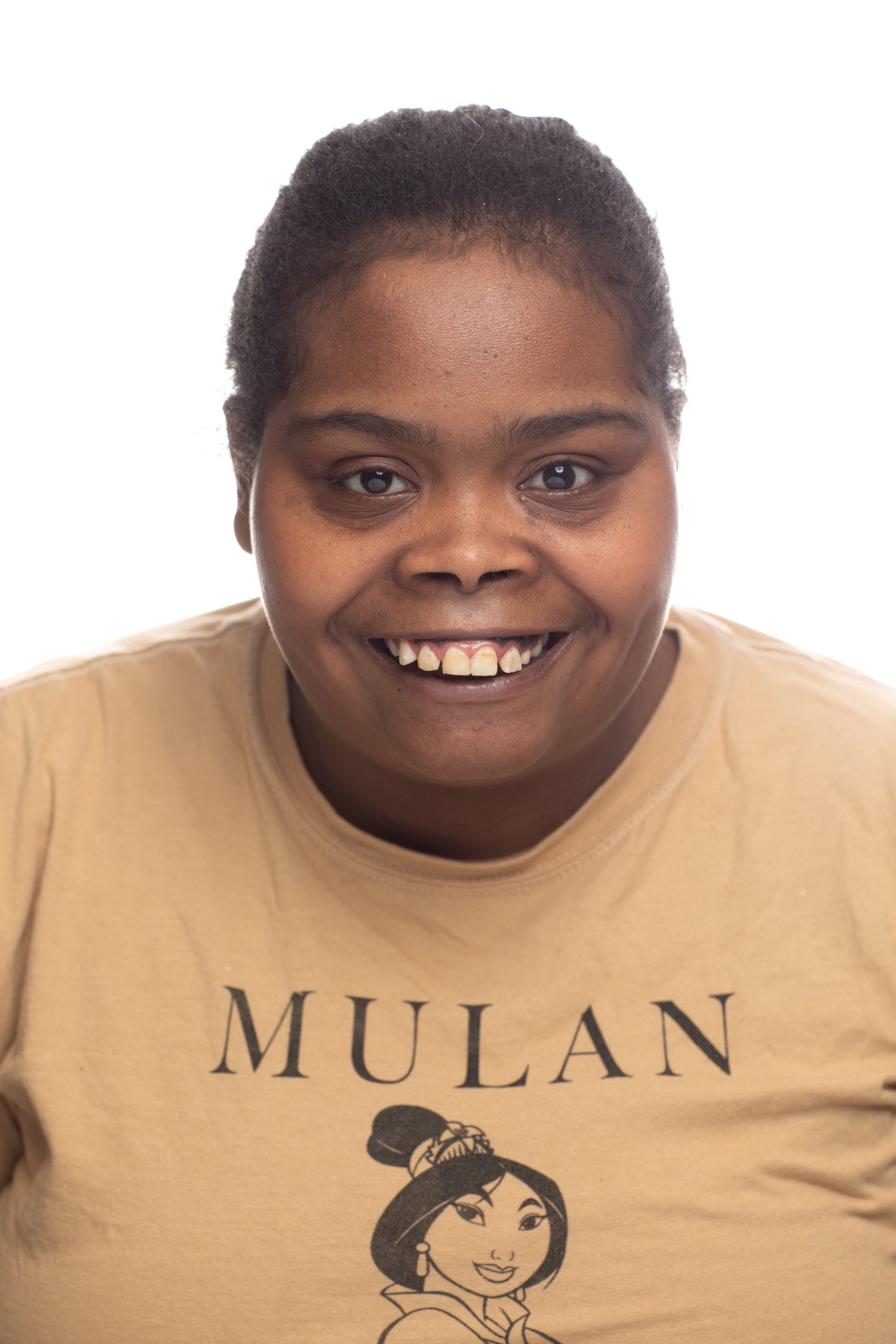 picture of young woman smiling wearing a brown shirt