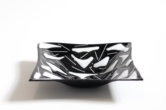 black glass plate with white sections and lines