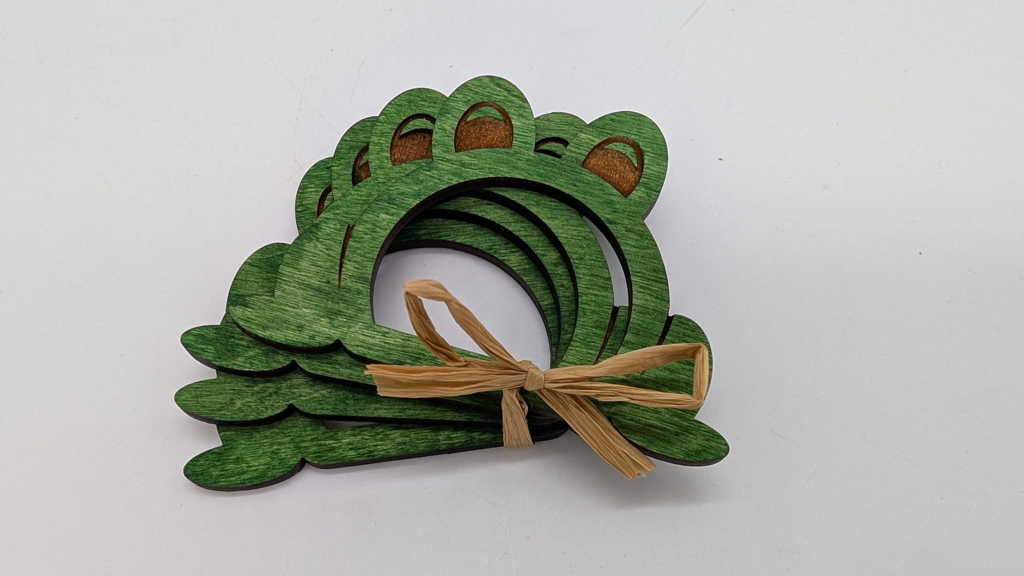 picture of 4 frog shaped napkin rings