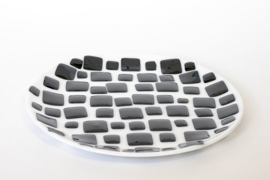 Round white fused glass plate with black diamonds pattern