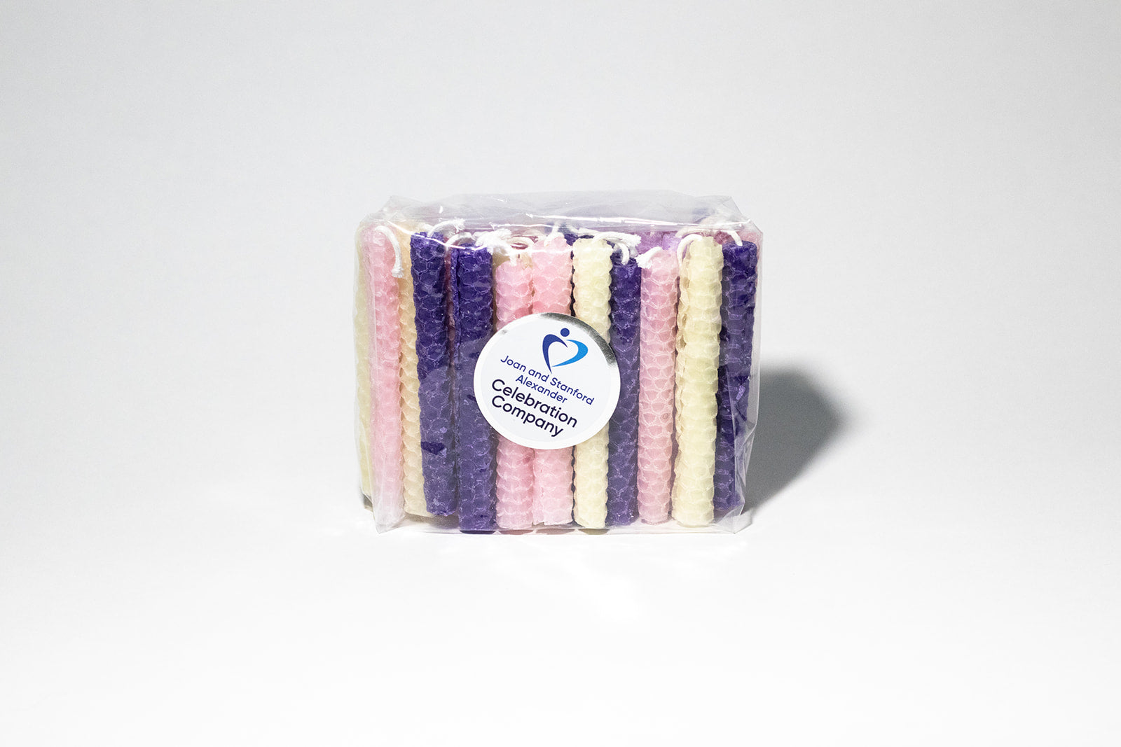 Packaged Princess themed hand-rolled beeswax candles in pink, lavender, purple and yellow