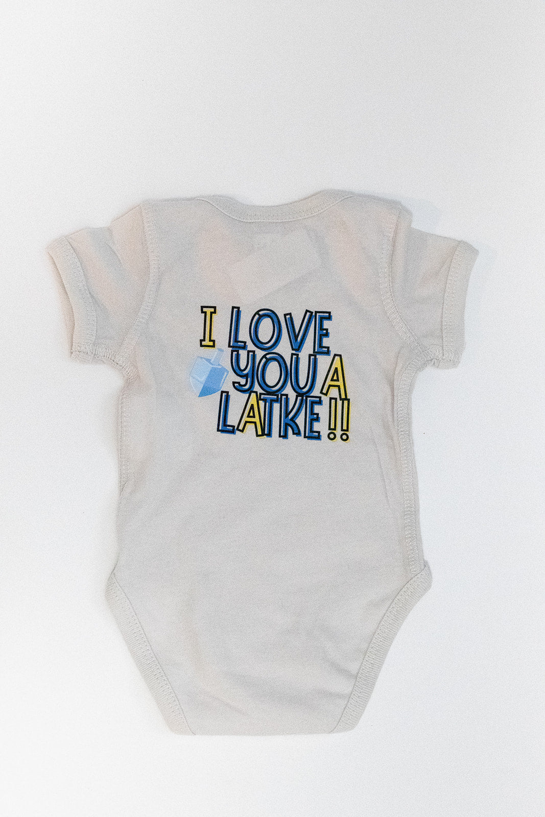 onesie with I love you a latke on it