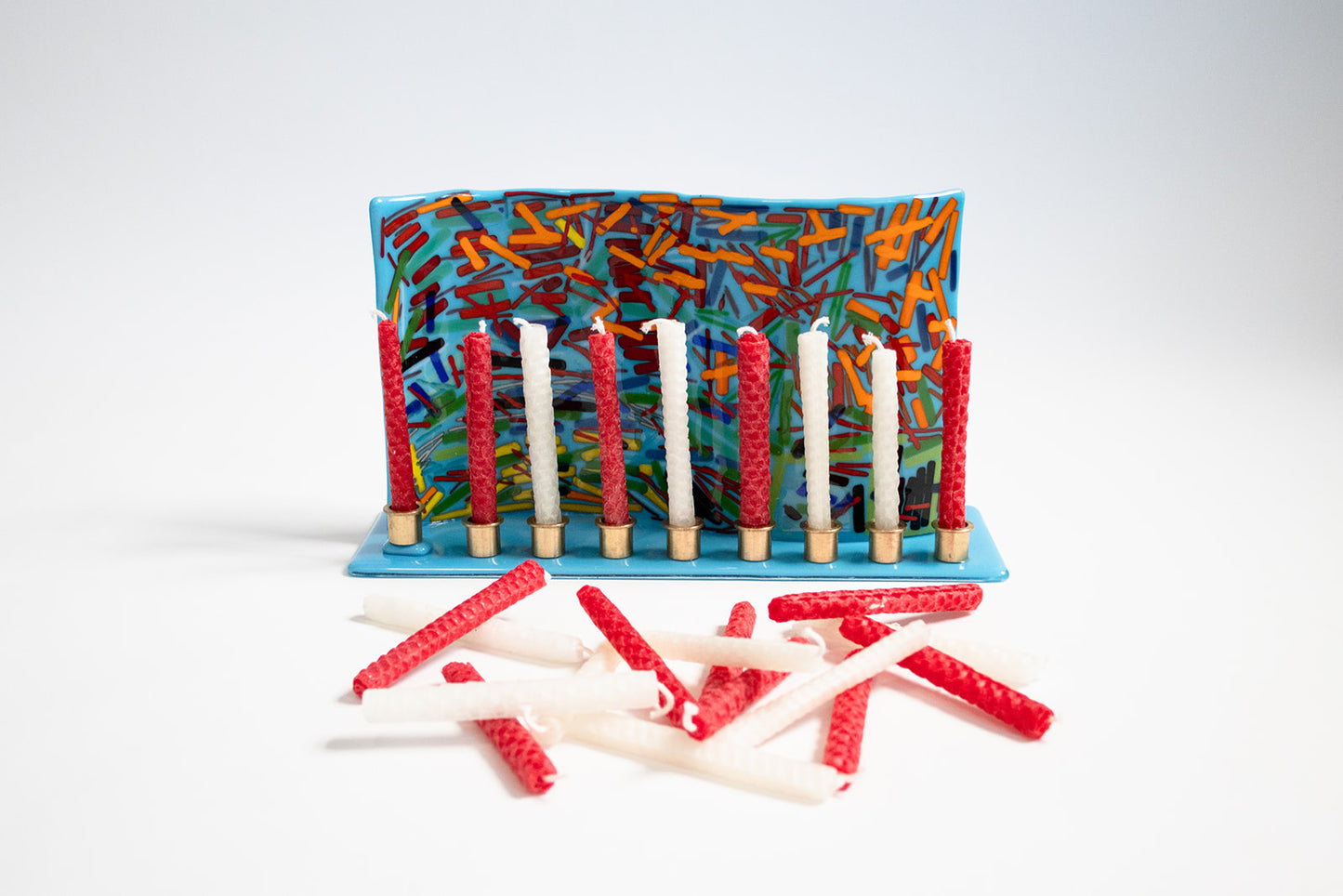 menorah holding red and white candles