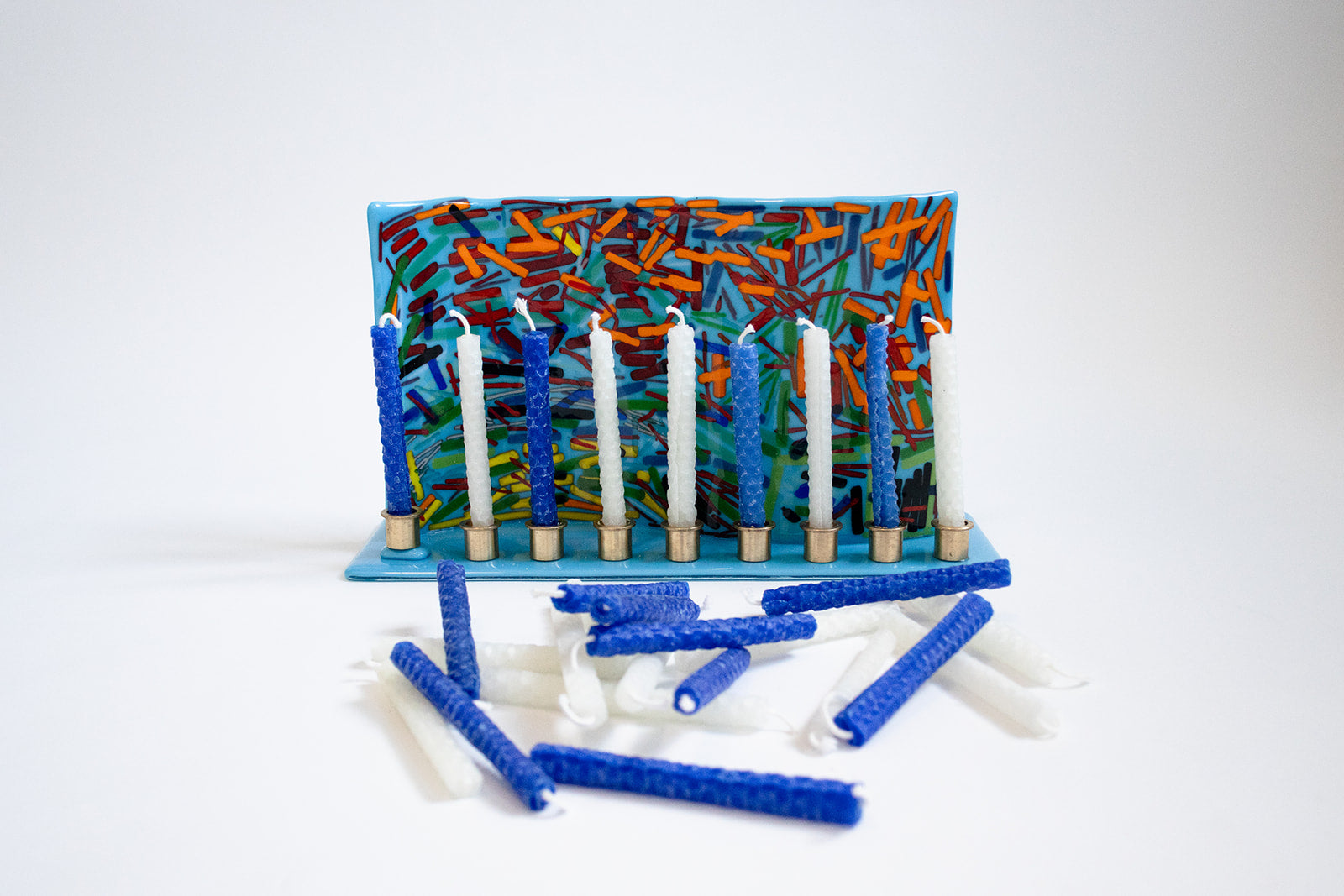 photo of a menorah holding just blue and white candles