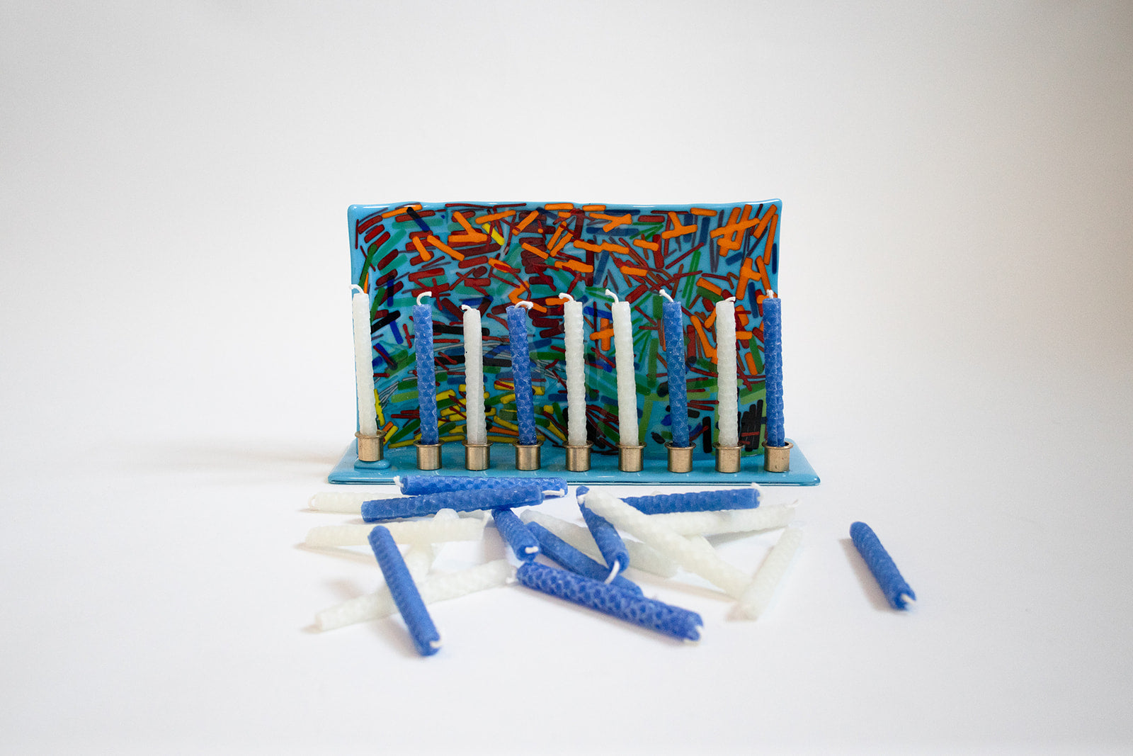 photo of a menorah holding just blue and white candles