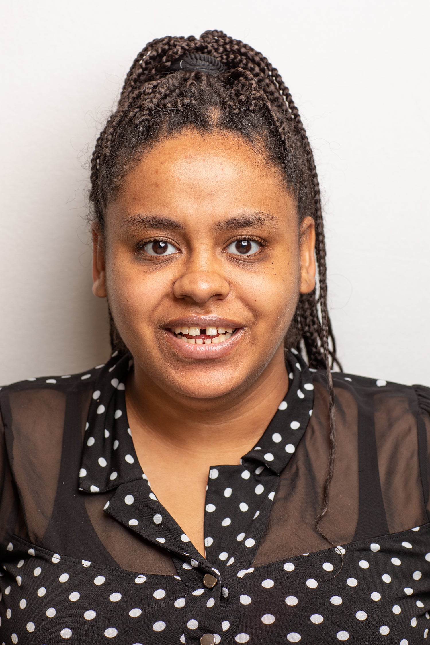 young african american woman wearing black and white polka dots