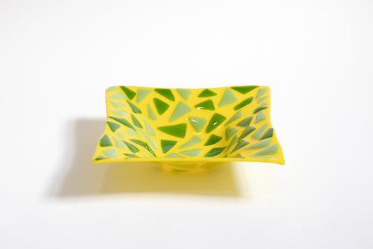 Yellow fused glass bowl with green triangles pattern