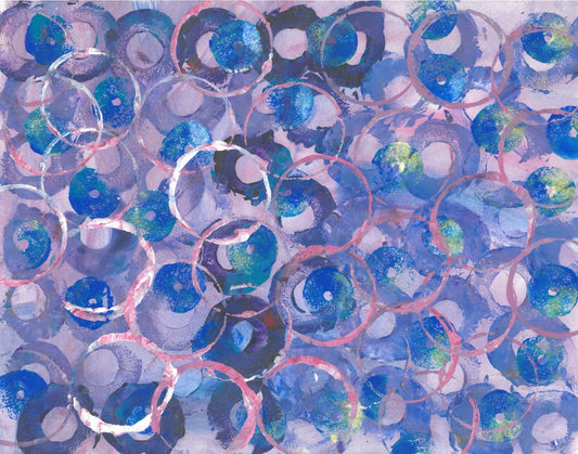 Abstract painting of pink and blue circles on a lavender background