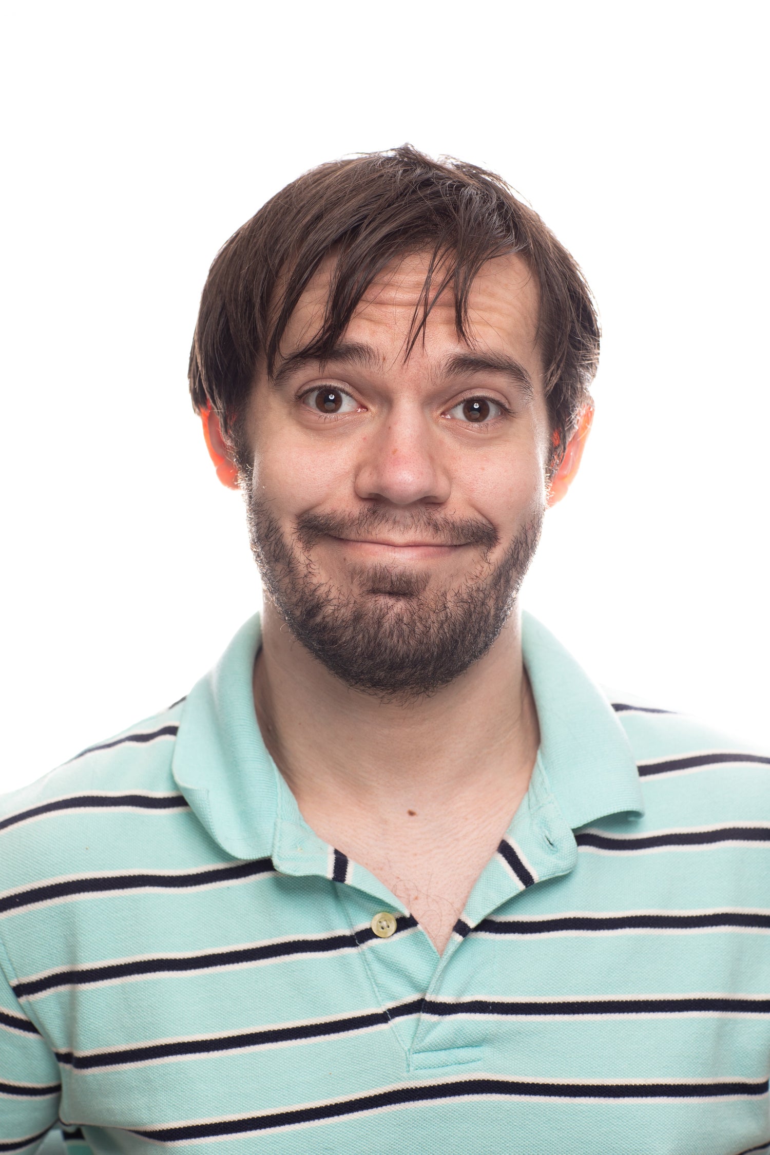 young man wearing stripped polo shirt smiling