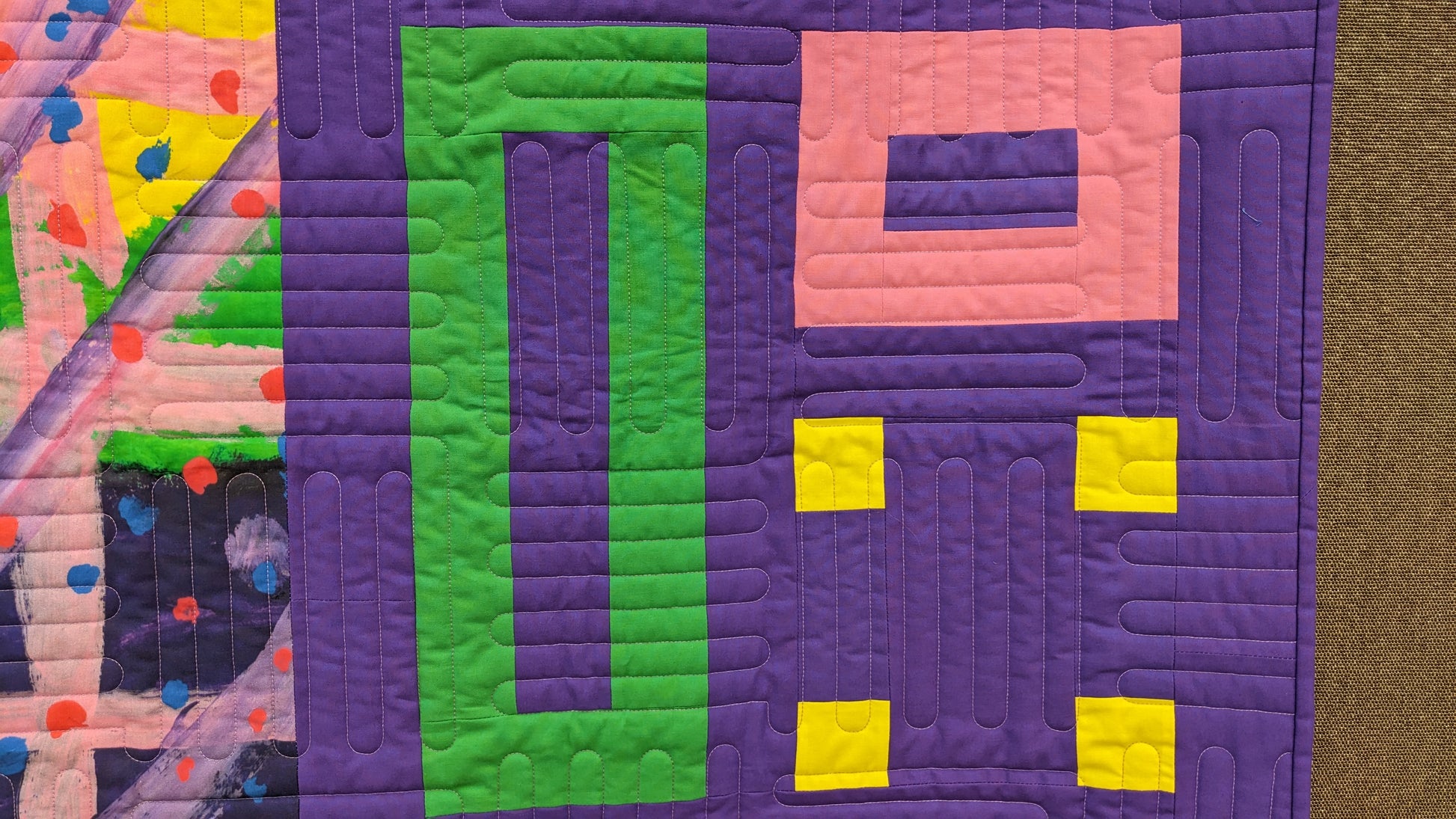 art quilt with purple, green, and yellow