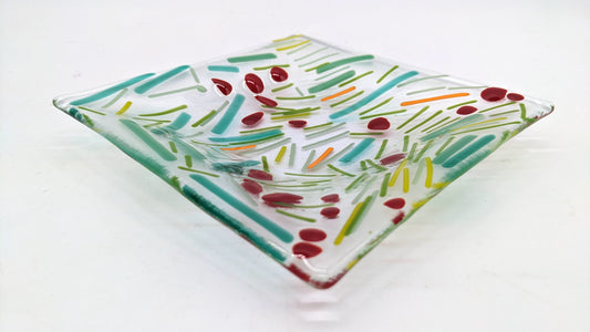 glass square dish with green lines and red dots