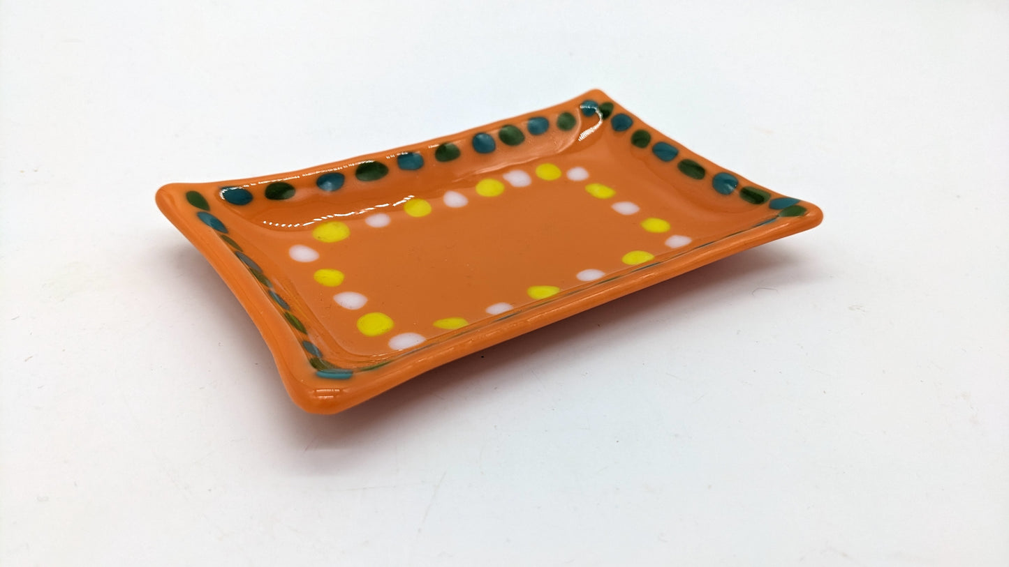 orange soap dish with boarder of green and yellow