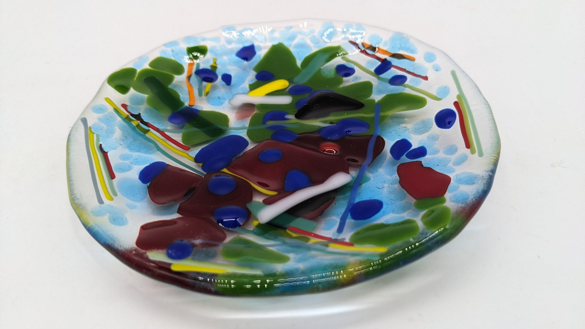 glass trinket plate with blues and greens