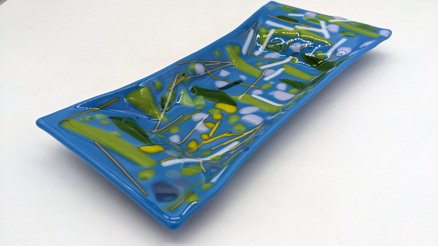 glass blue tray with lines of green and white dots