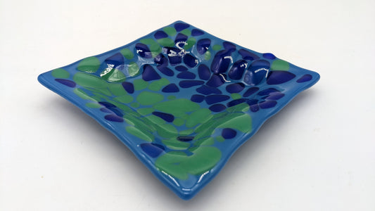 glass bowl with green and blues