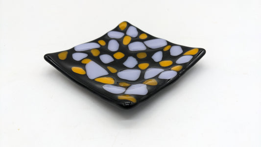 black swoop trinket dish with purple and yellow dots