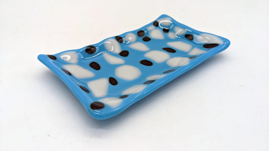 blue soap dish with white and dark red. dots in rows