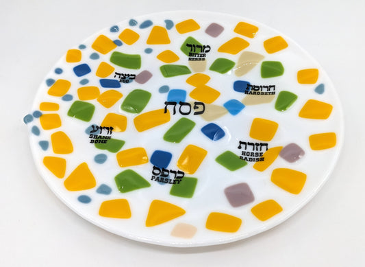 white seder plate with colorful squares through out