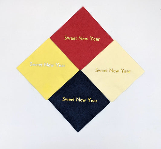 picture of 4 napkin colors: red, cream, yellow, navy with the saying sweet new year