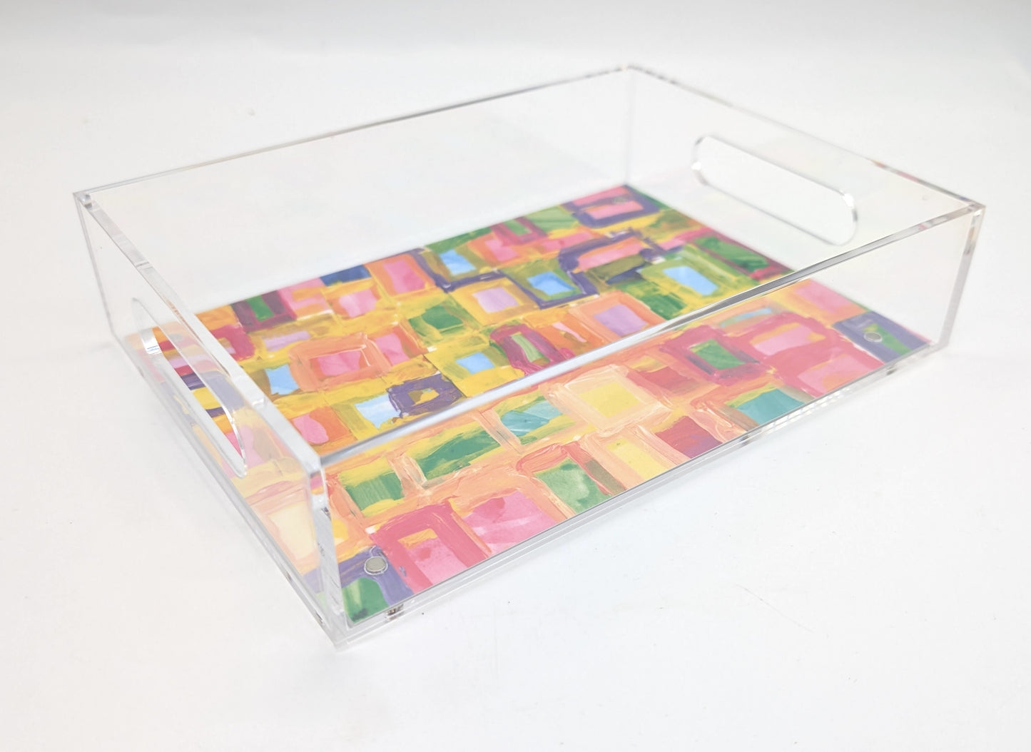 acrylic tray with an abstract pink and yellow design