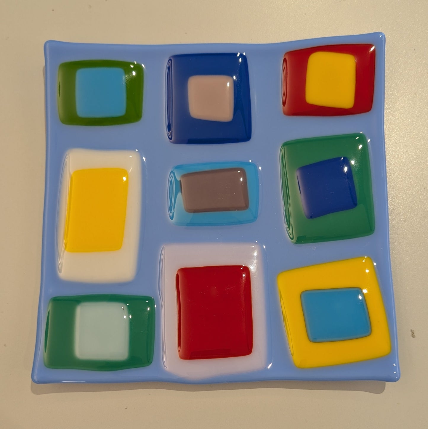 glass plate with a series of layered squares