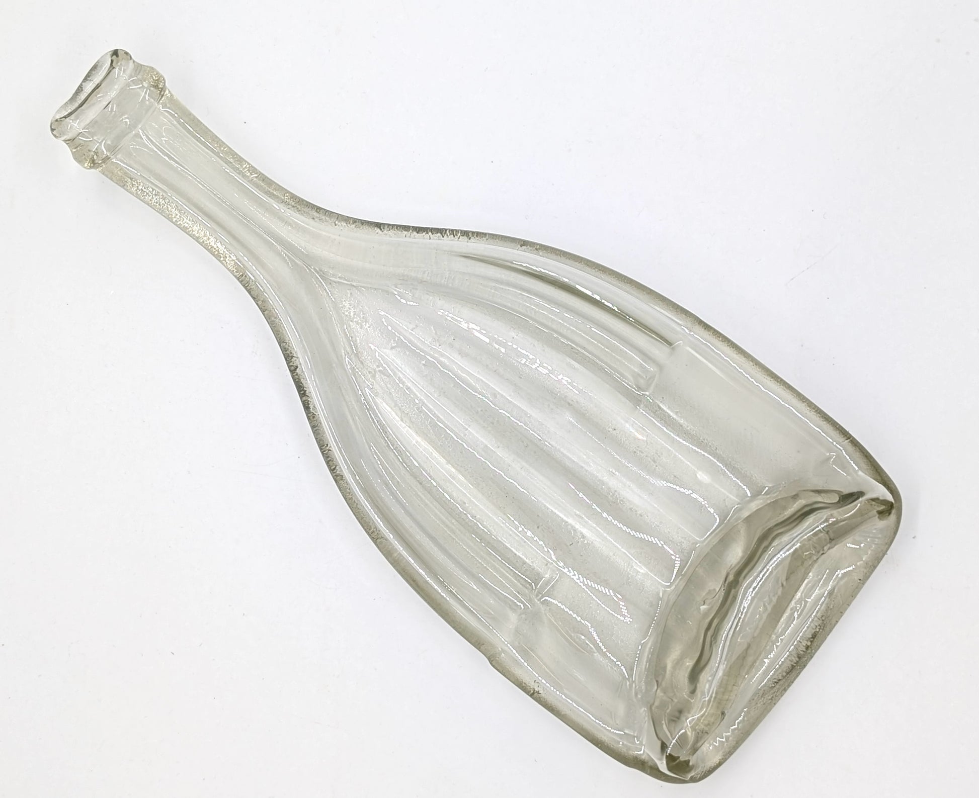 clear wine bottle formed into a dish