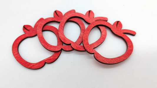 series of red wooden apple rings