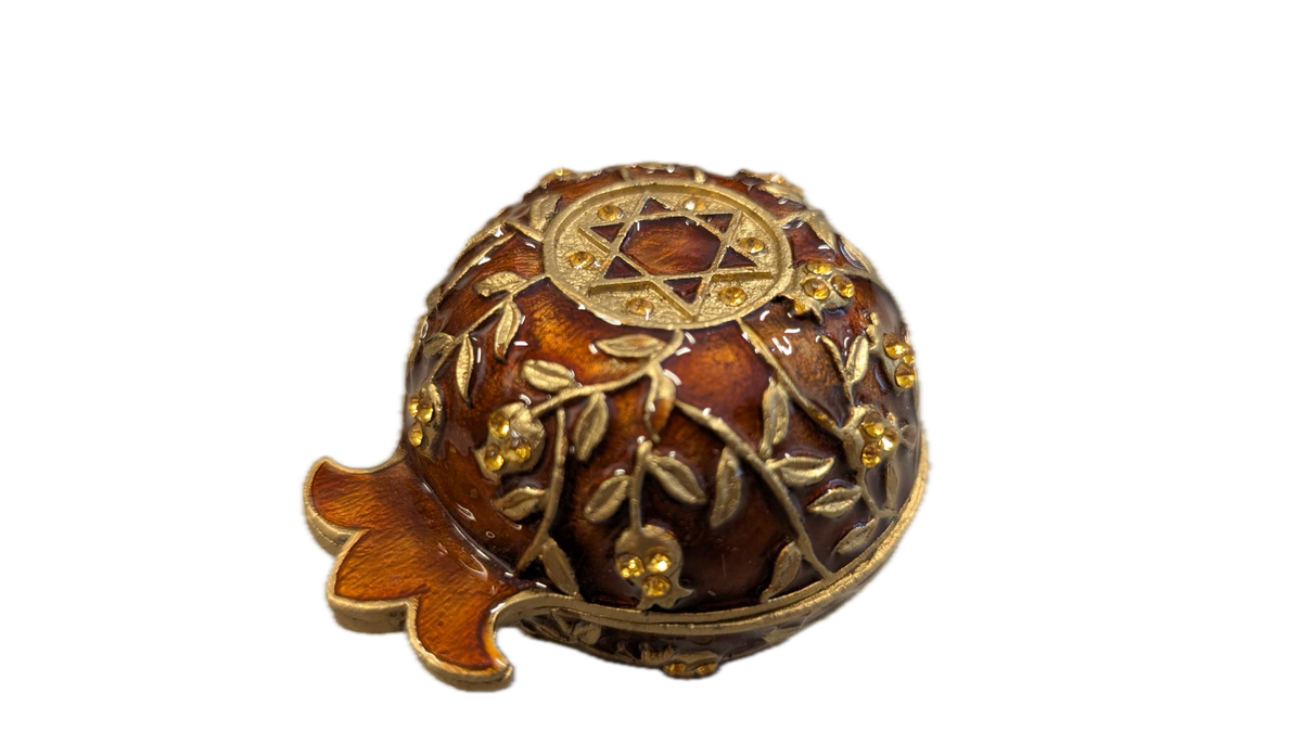 Closed candle holder in pomegranate shape