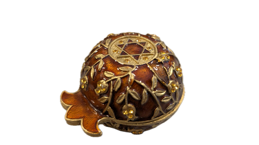 Closed candle holder in pomegranate shape