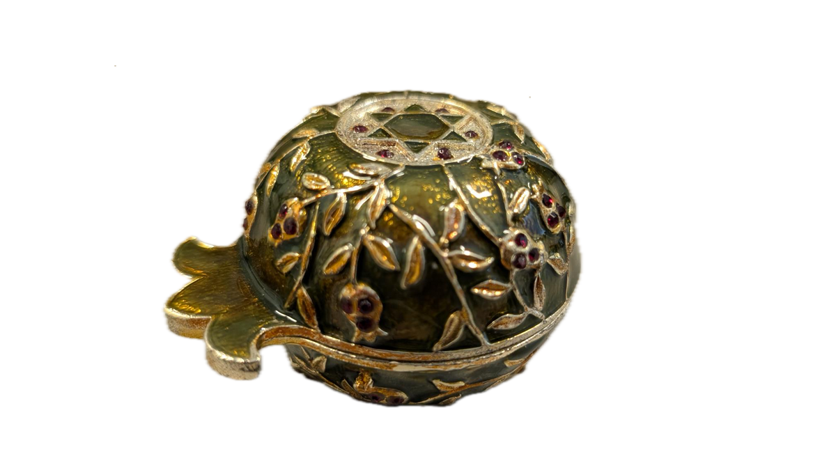 Closed candle holder in pomegranate shape