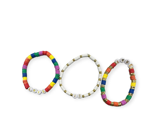 set of 3 bracelets with flat beads. 1 set rainbow with word love, 1 bracelet with white and gold beads with word is, 1 bracelet with rainbow and gold flat beads with the word love.