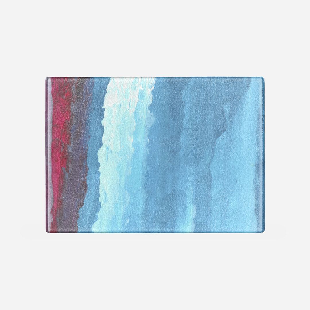 Rectangular glass cutting board with pink, red, dark blue and light blue gradient from left to right