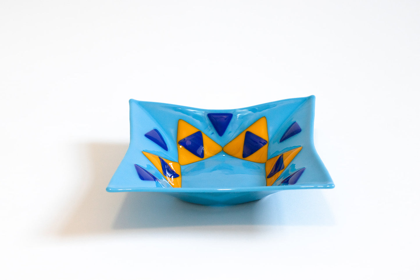 blue plate with triangles that form a star of david