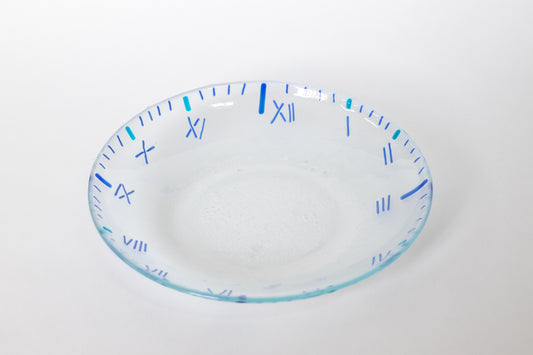 Clear glass bowl with blue lines emulating a clock