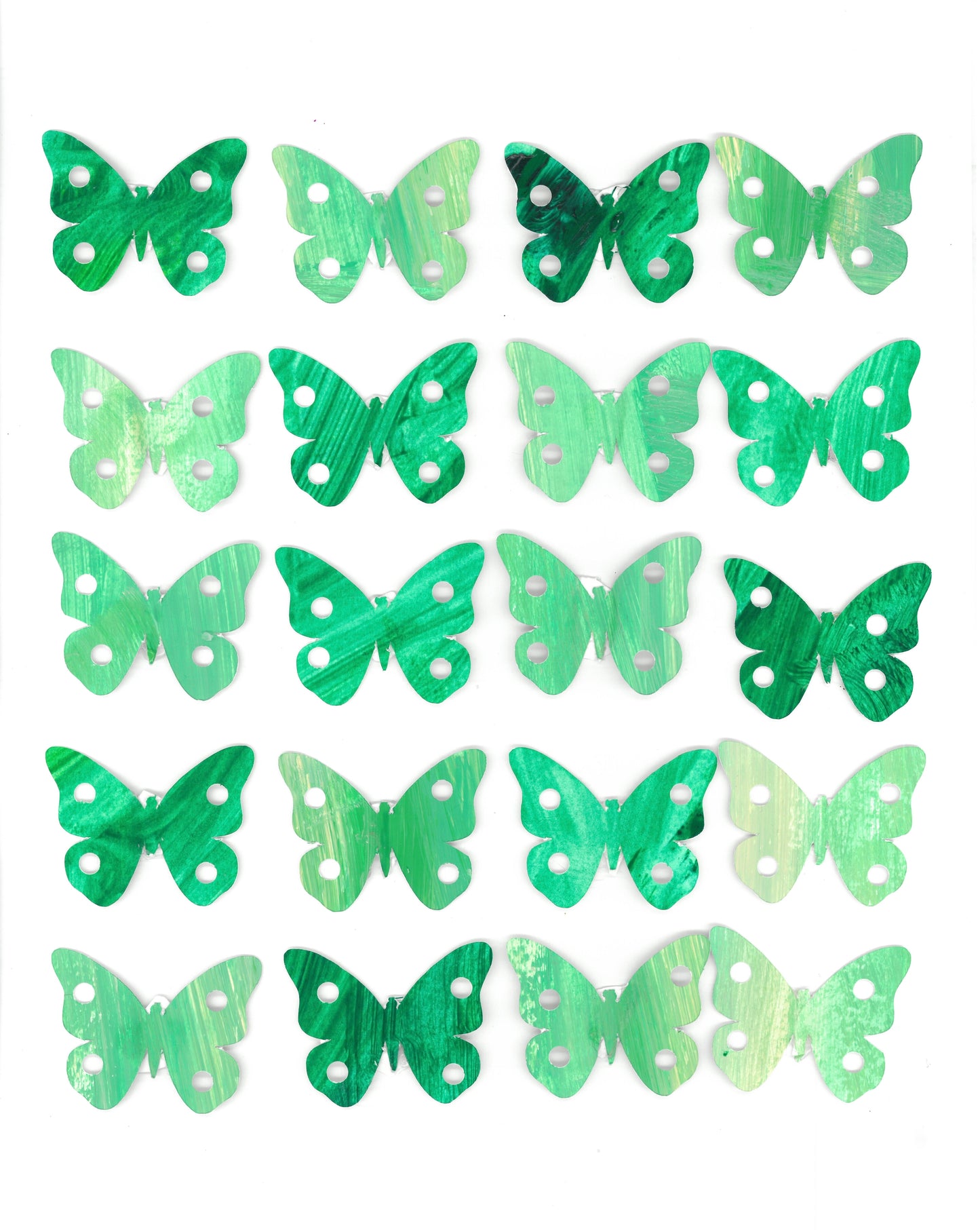 collage of butterfly cut outs in a grid of 4 x 5 all shades of green