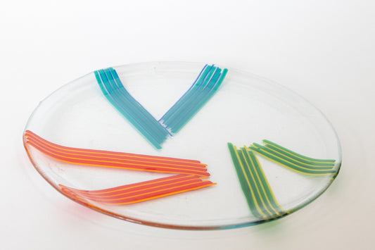 clear glass pate with three triangles of lines