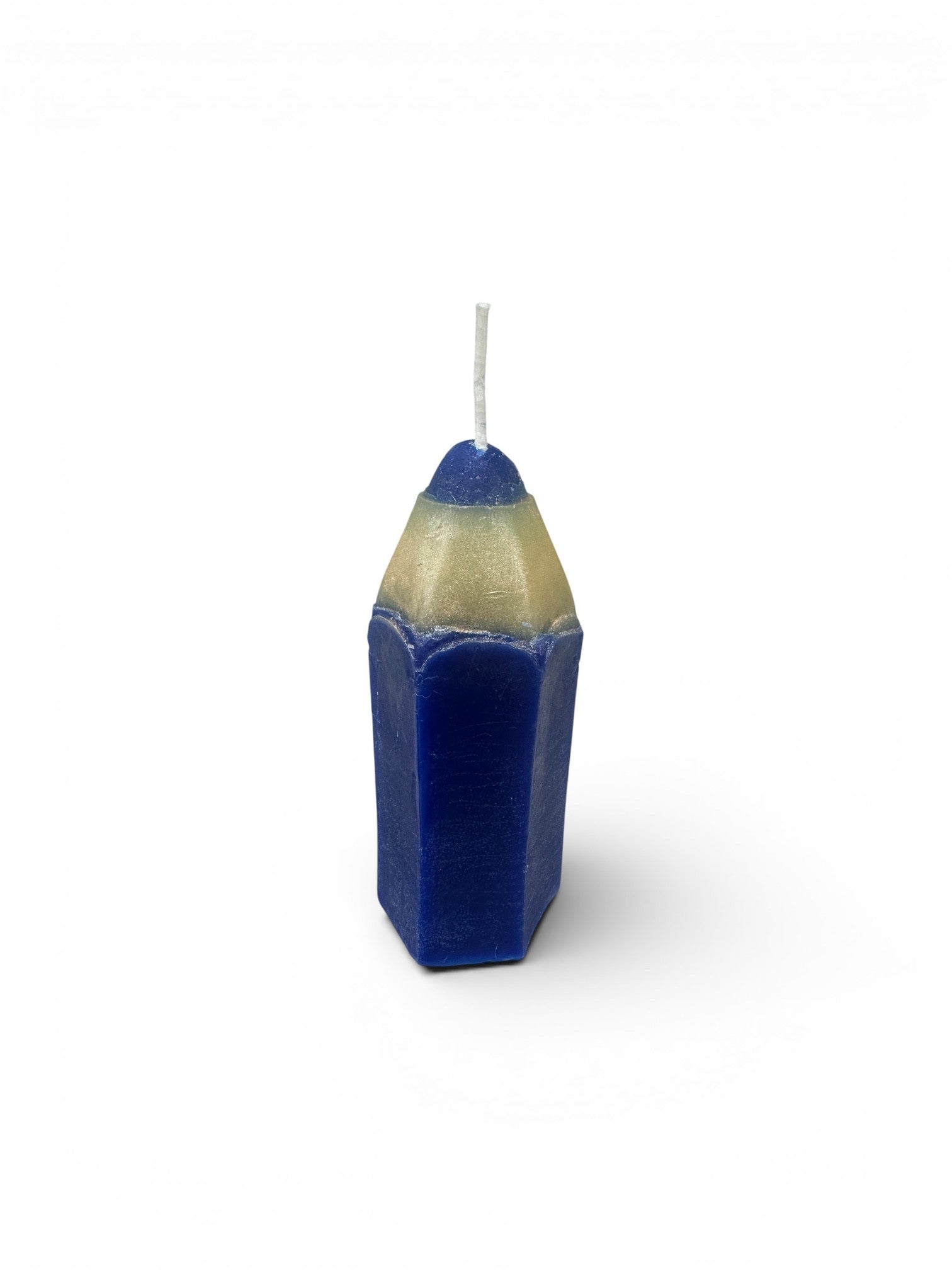 pencil-shaped candles handcrafted by the employees of Celebration Company, featuring a smooth hexagonal texture and a pointed wax tip. (color blue)