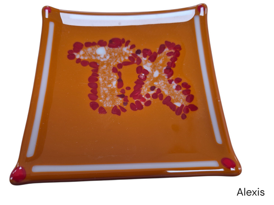 Colorful brown wavy glass with colorful dots with the TX Text.&nbsp;