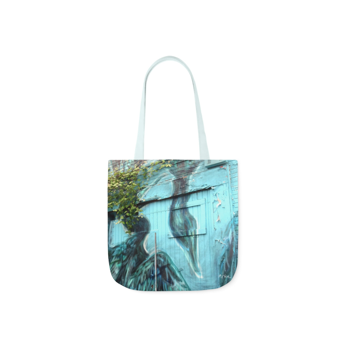 tote bag of a Photograph of blue crane mural covered by ivy