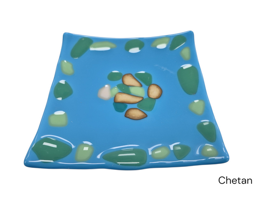 Colorful light blue pastel glass plate with pastel color dots, made by the talented employees of celebration company.