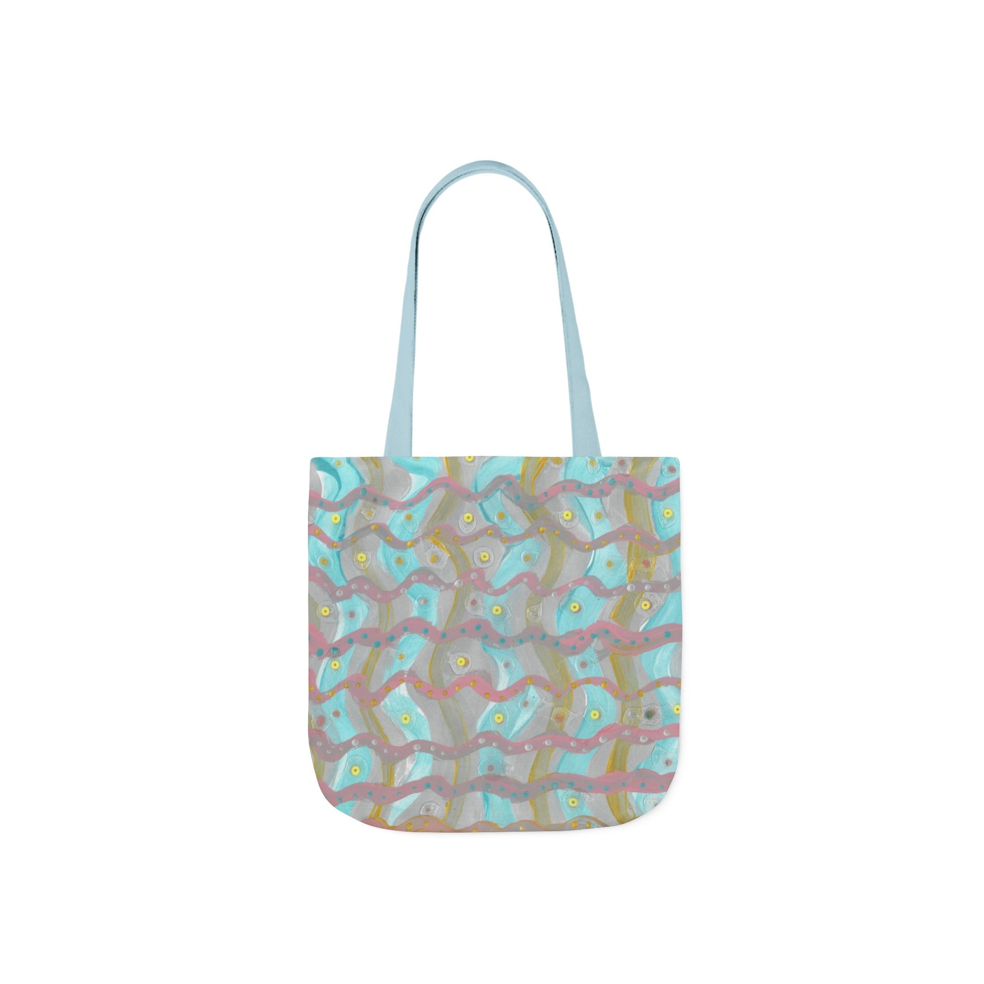 light blue canvas tote bag with crisscrossing zig zags of pink and gold