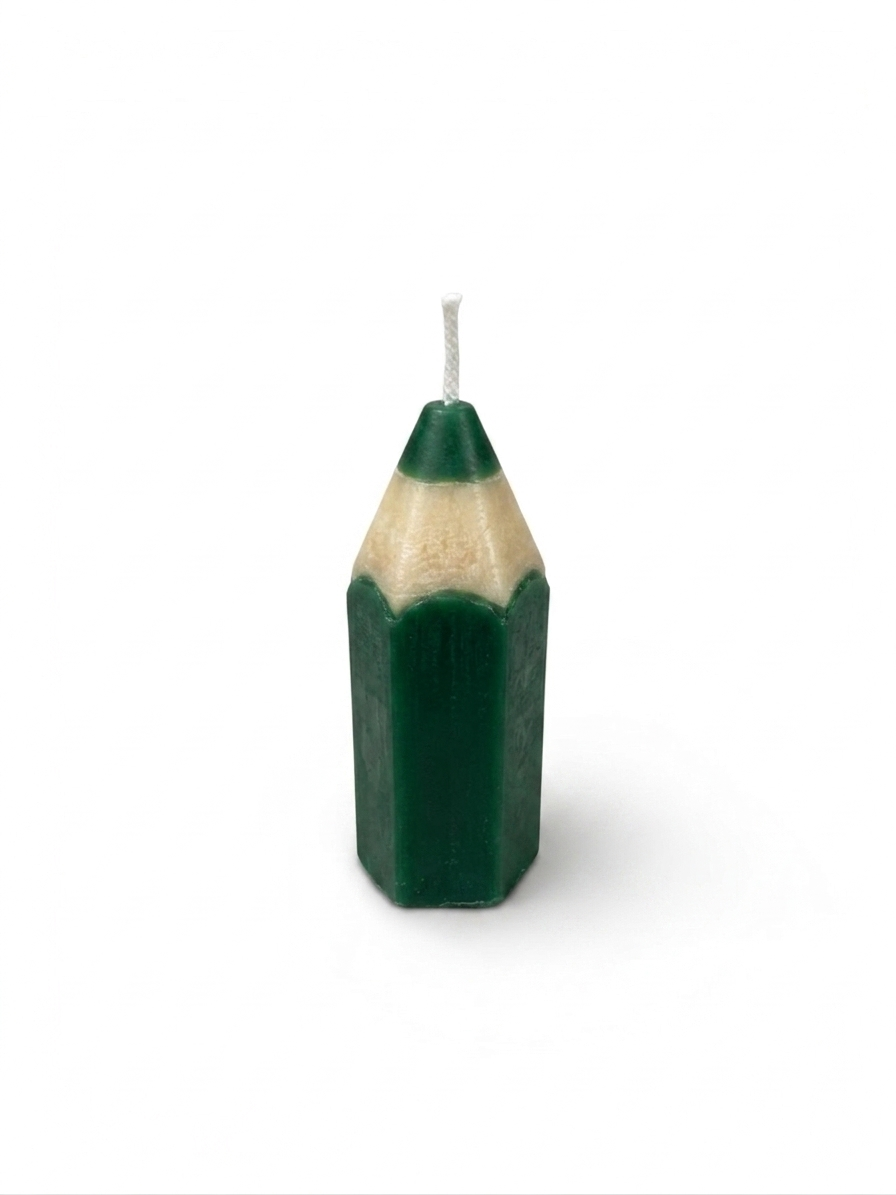pencil-shaped candles handcrafted by the employees of Celebration Company, featuring a smooth hexagonal texture and a pointed wax tip. (color green)