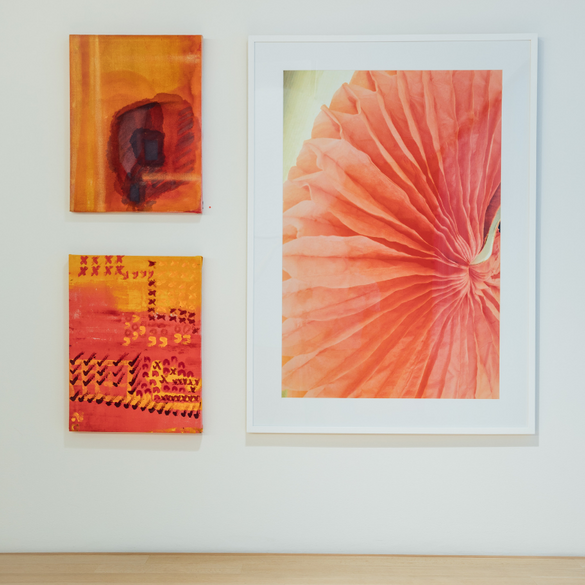 Three celebration company art pieces on the wall.