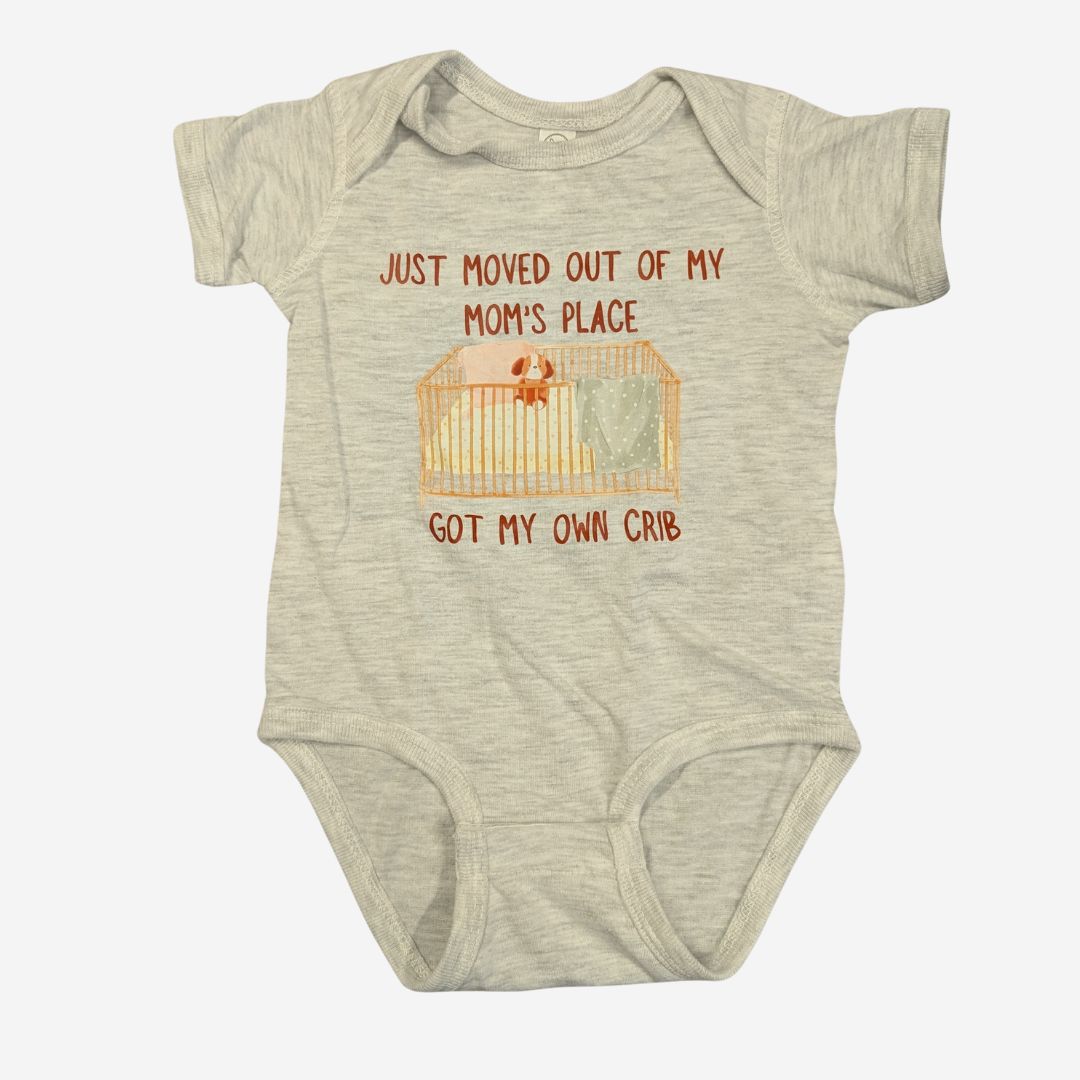 tan onesie that says just moved out of my mom's place,  got my own crib