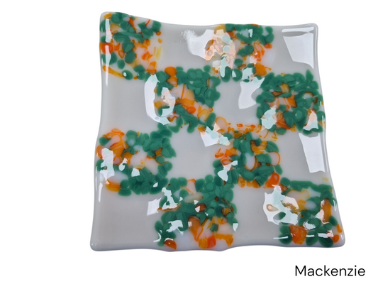 Colorful white glass wavy plate with colorful green dots.