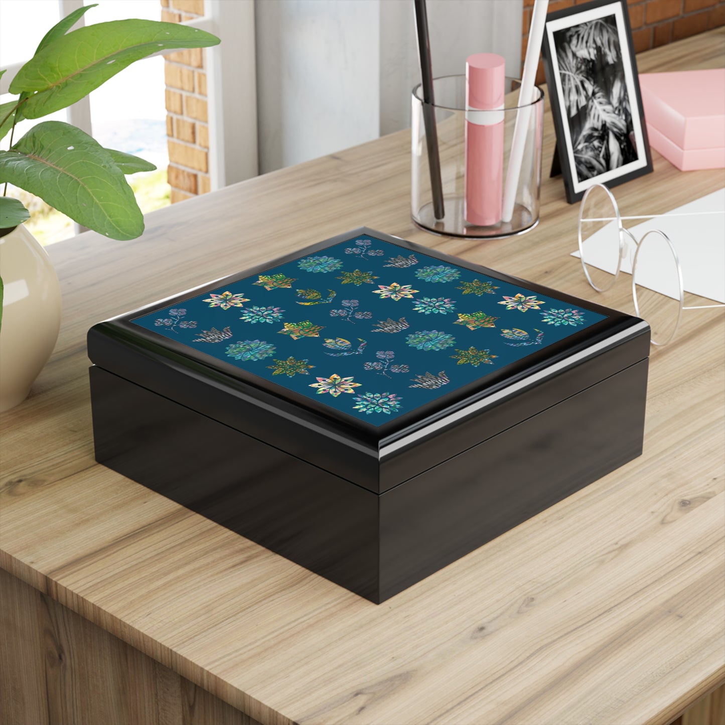 black jewelry box with decorative lid of rows of flowers